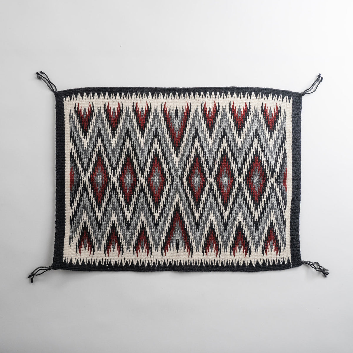 Red "Diamond Pattern Eye Dazzler" Navajo weaving, by Ivan Catron