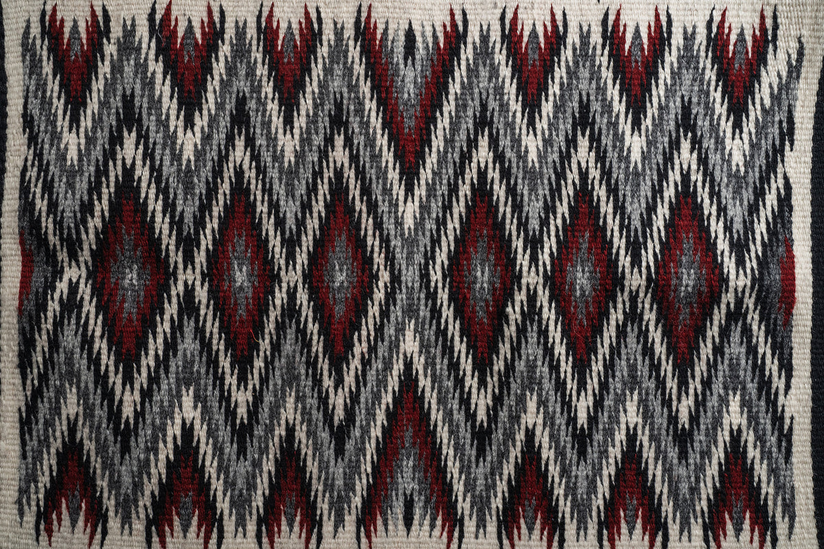 Red "Diamond Pattern Eye Dazzler" Navajo weaving, by Ivan Catron