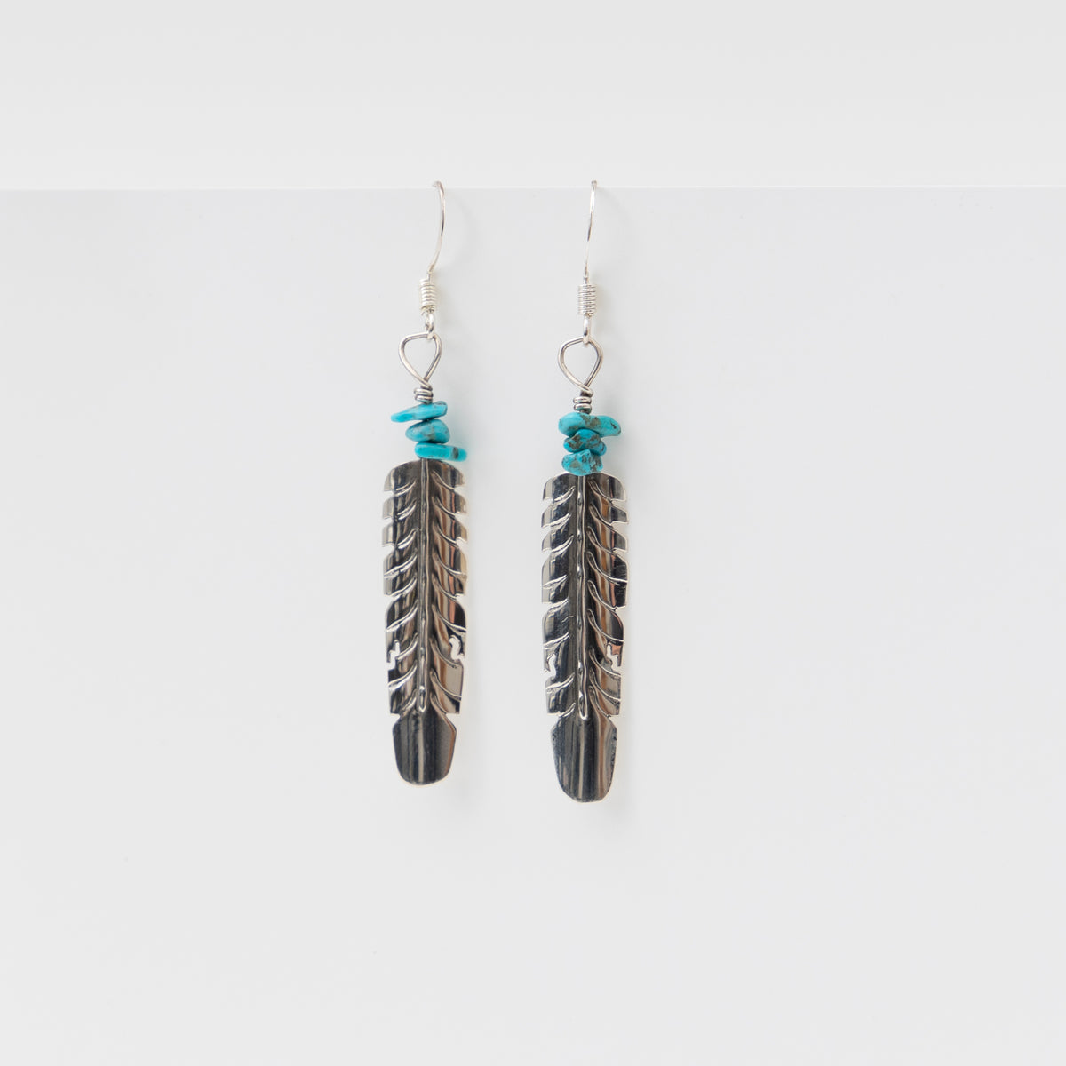 Silver feather drop earrings
